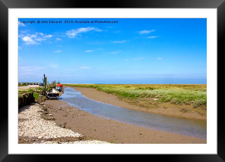 Low tide at Thornham Staithe  Framed Mounted Print by John Edwards