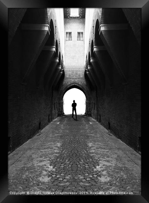 Narrow street gang with scary man silhouette Framed Print by Dragos Nicolae Dragomirescu