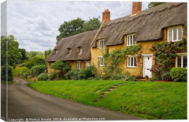 Thatched Cottages Wadenhoe Village Northants Canvas Print by Martyn Arnold