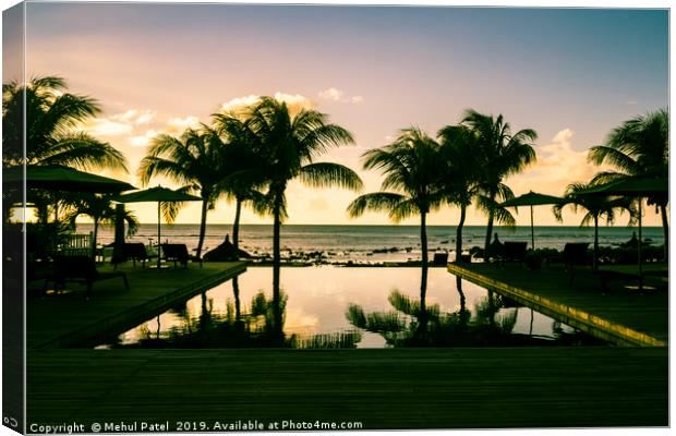 Infinity pool at resort in Mauritius during sunset Canvas Print by Mehul Patel