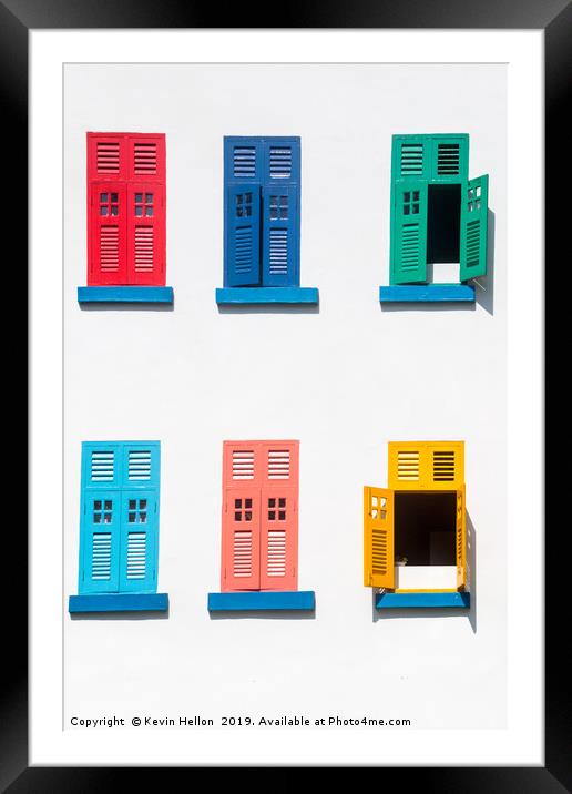 Colourful windows on a building Framed Mounted Print by Kevin Hellon