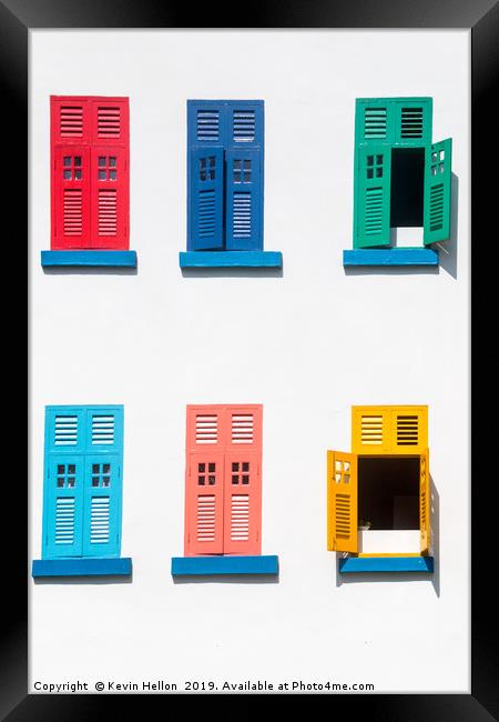 Colourful windows on a building Framed Print by Kevin Hellon