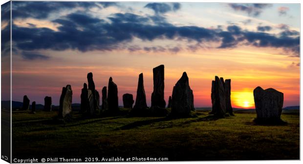 Sunset over the  Callanish Standing Stones Canvas Print by Phill Thornton