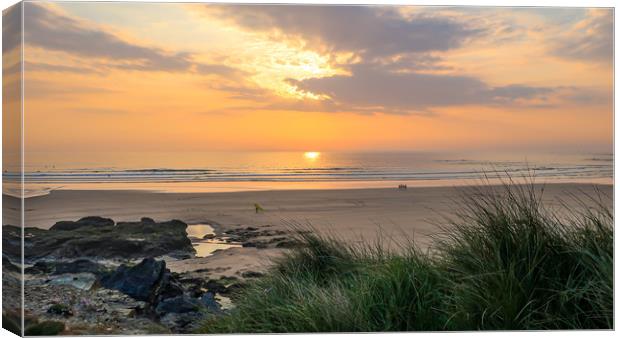 Surfers at sunset Canvas Print by Brenda Belcher