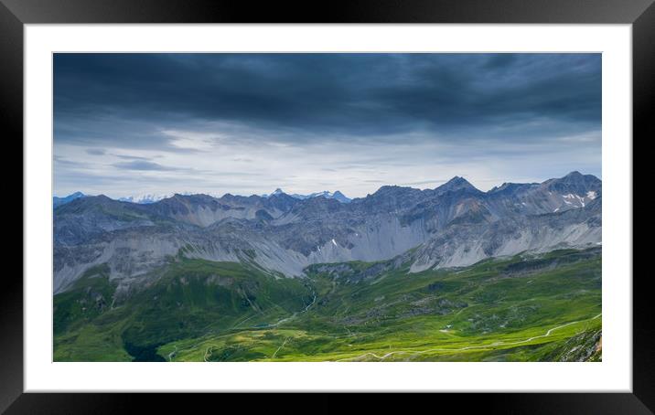 Clouds, mountains and pasture Framed Mounted Print by Rob Evans