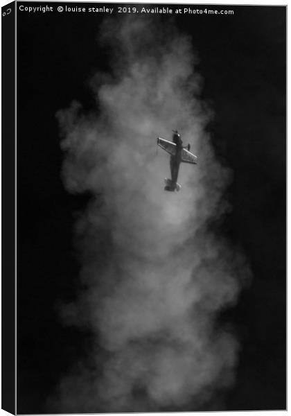  Aerobatic plane emerging from its smoke trail Canvas Print by louise stanley