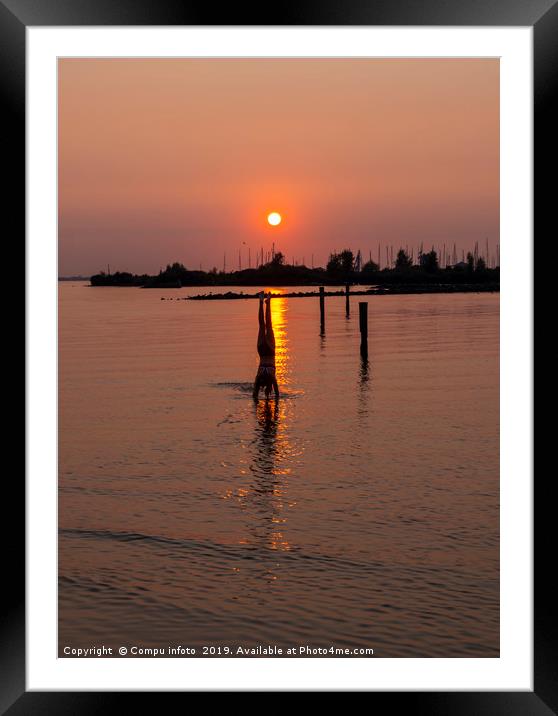 girl doing a handstand in the water during sunset Framed Mounted Print by Chris Willemsen