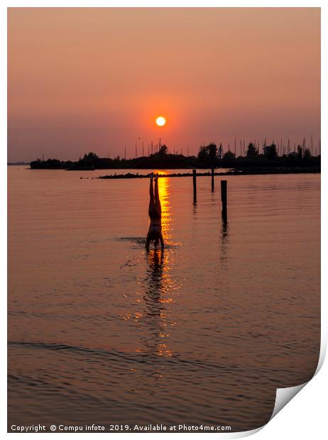 girl doing a handstand in the water during sunset Print by Chris Willemsen
