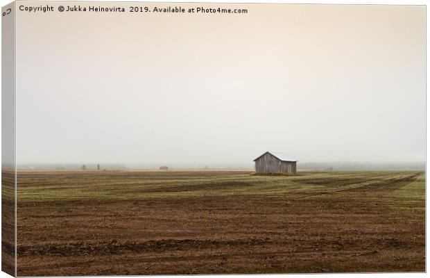 Mist Over The Empty Fields Canvas Print by Jukka Heinovirta
