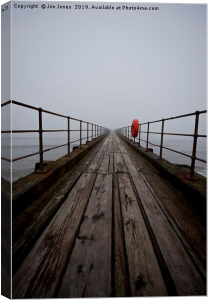Wooden pier disappearing into the fog Canvas Print by Jim Jones