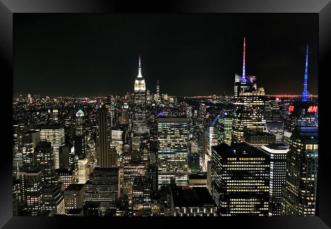 Manhattan At Night Framed Print by Phil Clements