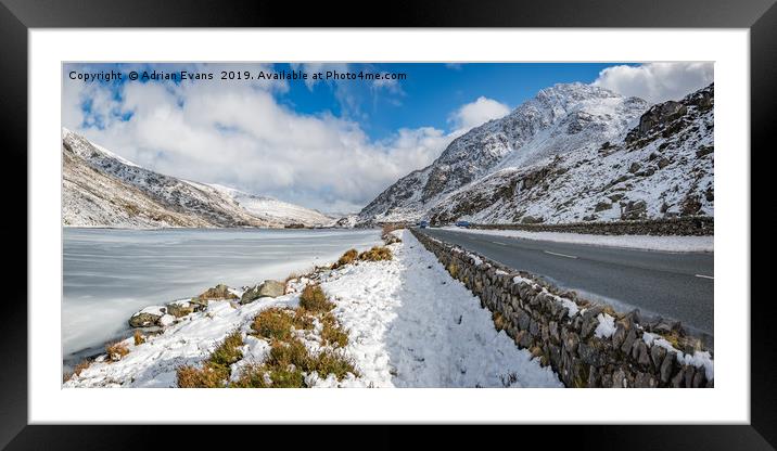 Frozen Lake Snowdonia Framed Mounted Print by Adrian Evans