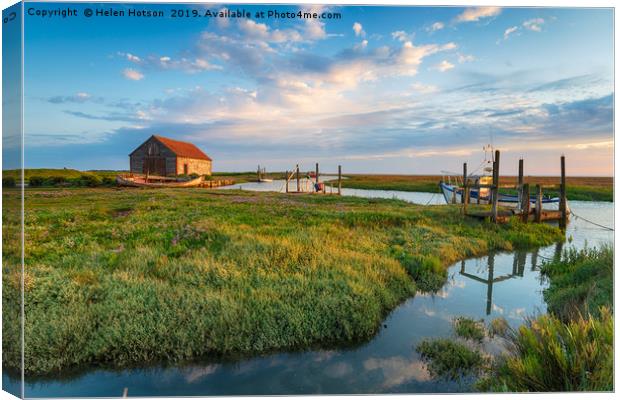 The picturesque old harbour at Thornham in Norfolk Canvas Print by Helen Hotson