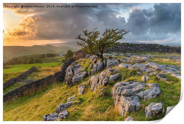 Stormy sunset over a small limestone pavement Print by Helen Hotson