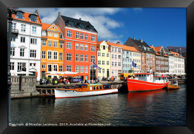 famous Nyhavn place in Copenhagen, Denmark Framed Print by M. J. Photography
