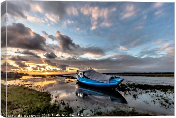 Stormy skies at sunset at Penclawdd Canvas Print by Jo Evans