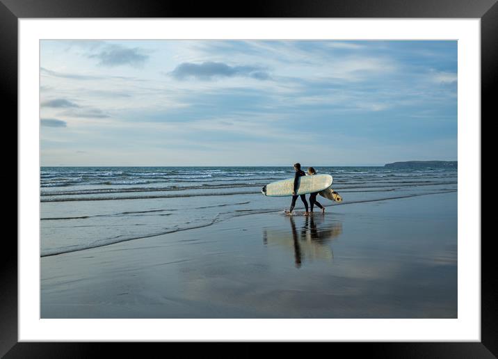 Surfer couple entering the sea at Westward Ho! Framed Mounted Print by Tony Twyman