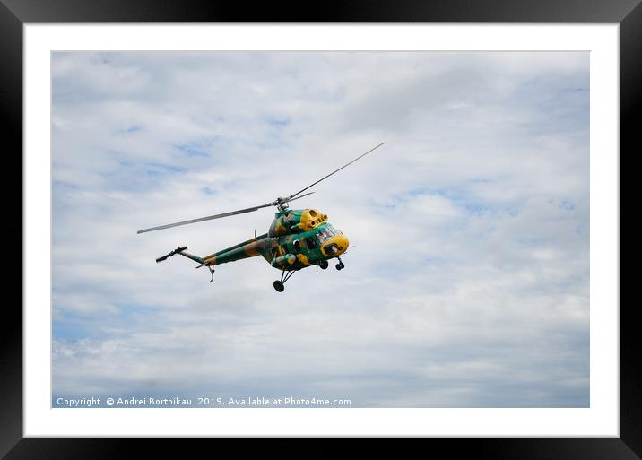 Khaki colored helicopter is flying in sky Framed Mounted Print by Andrei Bortnikau
