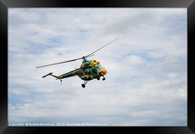 Khaki colored helicopter is flying in sky Framed Print by Andrei Bortnikau