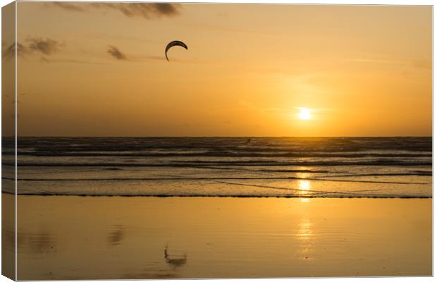Sunset kite surfer at Westward Ho! in Devon Canvas Print by Tony Twyman