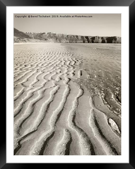 Sand patterns beach, Rhossili village, Gower, UK Framed Mounted Print by Bernd Tschakert