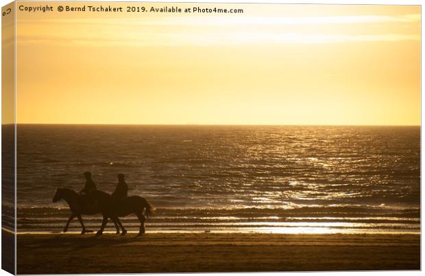 Beach Sunset, Two Horse Rider Silhouettes, England Canvas Print by Bernd Tschakert