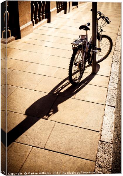 Bicycle In Sunlight Canvas Print by Martyn Williams