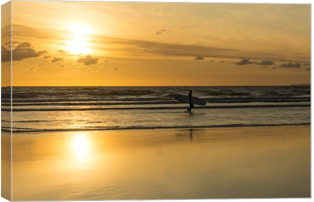 Sunset surfer at Westward Ho! North Devon Canvas Print by Tony Twyman