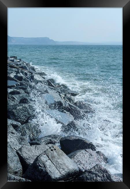 Lyme Regis breakwater rocks Framed Print by Peter Smith