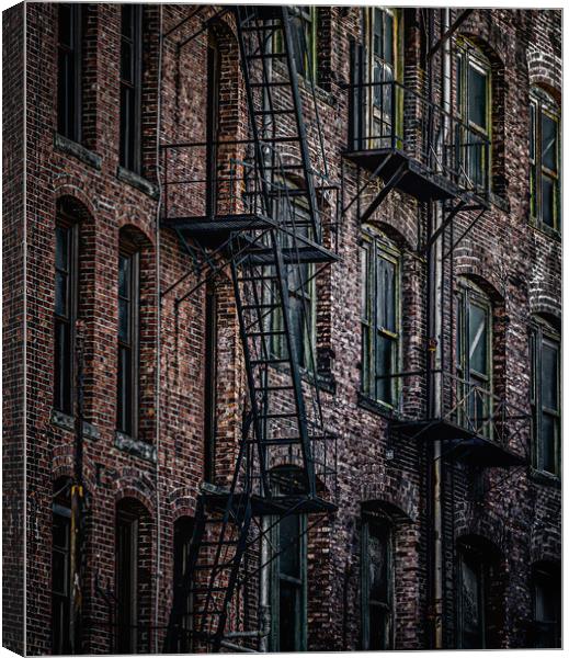 Wrought Iron Fire Escapes in Brick Alley Canvas Print by Darryl Brooks