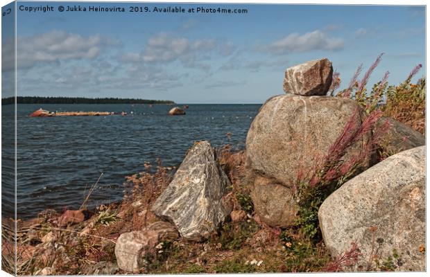 Pile Of Rocks By The Sea Canvas Print by Jukka Heinovirta