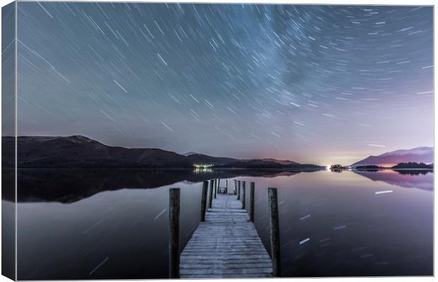 Star trails in the frost, Lake District. Canvas Print by John Finney