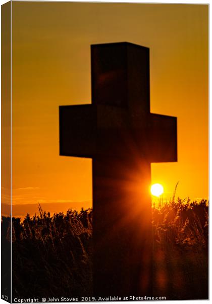 A cross at sunset Canvas Print by John Stoves