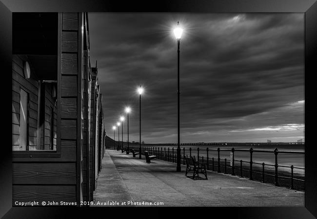Beach Huts at sunset in Black and White Framed Print by John Stoves