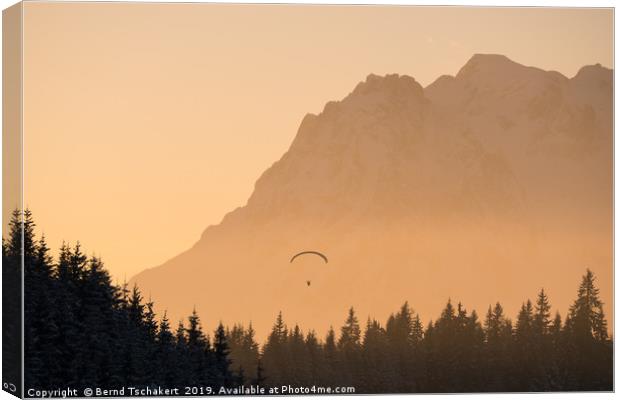 Paraglider in front of mountain, Salzburg, Austria Canvas Print by Bernd Tschakert