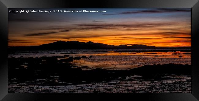 Awe-Inspiring Sunset Over the Isle of Arran Framed Print by John Hastings