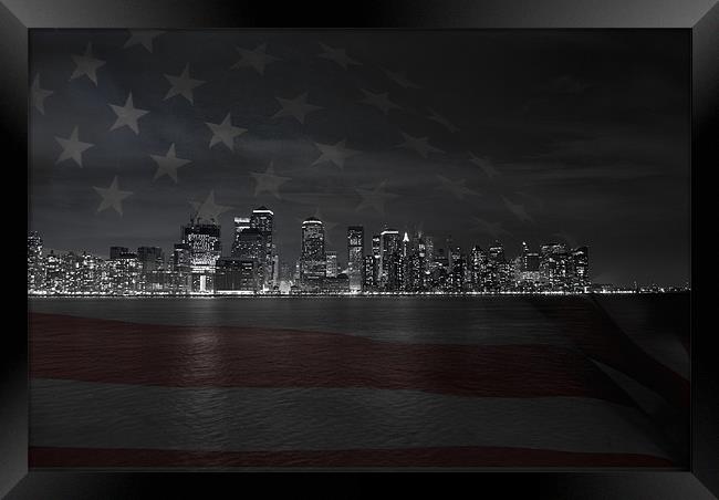 Manhattan with US flag Framed Print by Thomas Stroehle