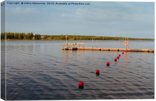 Pier And Buoys On The Lake Canvas Print by Jukka Heinovirta