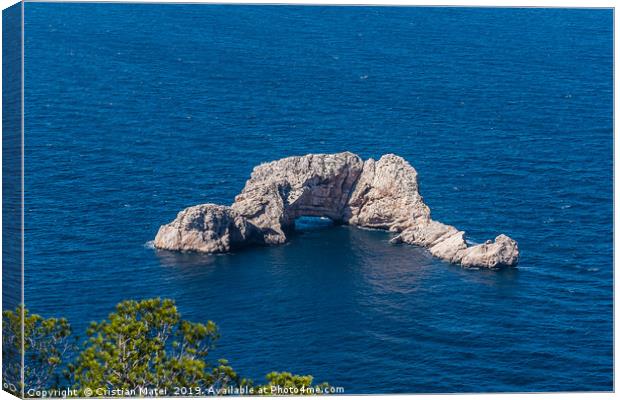 Sa Foradada rock on the blue water of Ibiza Island Canvas Print by Cristian Matei