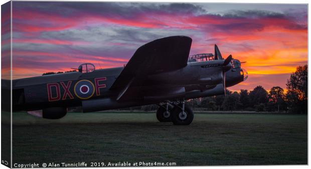 Lancaster bomber Just Jane with a sunset Canvas Print by Alan Tunnicliffe
