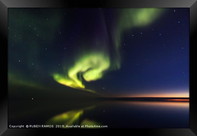 Northern Boreal Lights at sea in Canada. Framed Print by RUBEN RAMOS