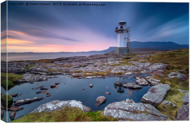 A long exposure of the lighthouse at Rhue Canvas Print by Helen Hotson