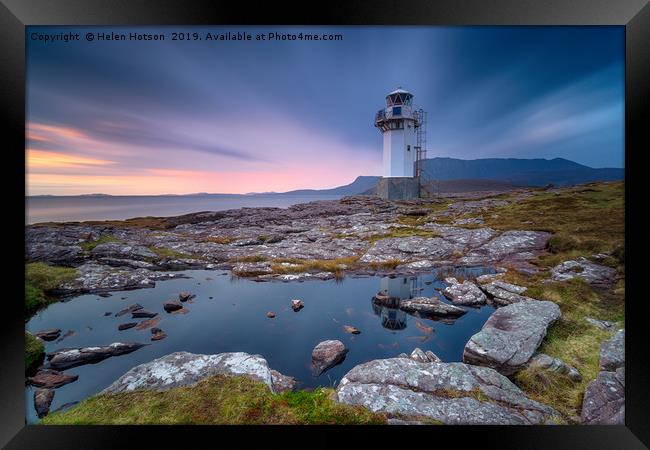 A long exposure of the lighthouse at Rhue Framed Print by Helen Hotson