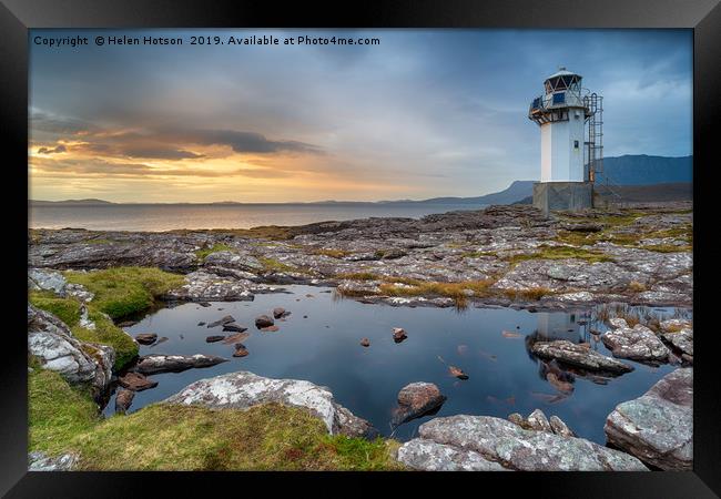 Stormy sunset at Rhe lighthouse near Ullapool  Framed Print by Helen Hotson