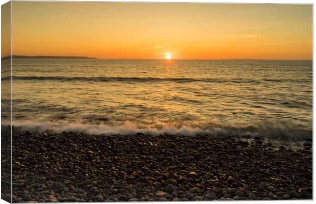 Westward Ho pebble beach sunset  Canvas Print by Tony Twyman