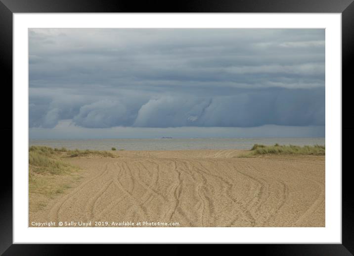 Storm clouds rolling at Great Yarmouth Framed Mounted Print by Sally Lloyd