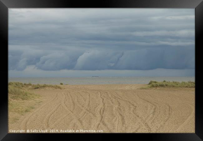 Storm clouds rolling at Great Yarmouth Framed Print by Sally Lloyd