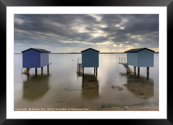 Shafts of light over Osea Beach Huts Framed Mounted Print by Andrew Ray