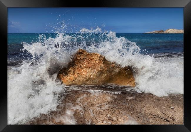 Crashing wave on a Greek beach Framed Print by Leighton Collins