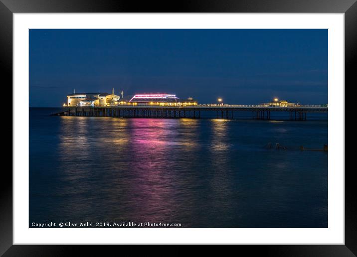 Cromer Pier at night in North Norfolk Framed Mounted Print by Clive Wells